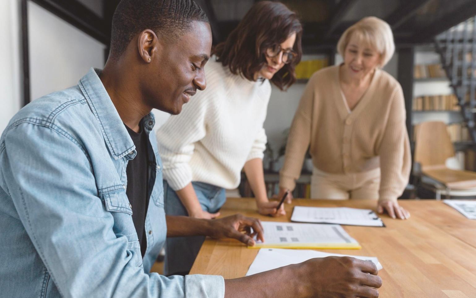 Trader analyzing multiple chart patterns on dual monitors showing various technical indicators and price movements